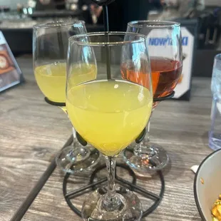 mimosa flight -OJ, pineapple, cranberry