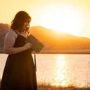 Young woman posing for graduation pictures.