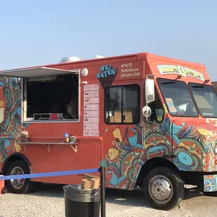 a colorful food truck parked in a parking lot