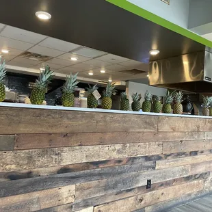 pineapples lined up on the counter