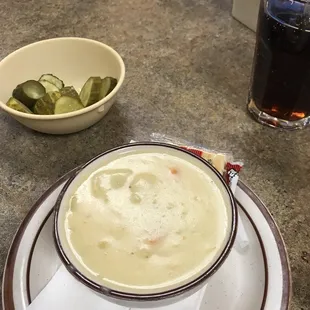 Cup of potato soup with complimentary pickles. The soup is free with any purchase when the temp is 10 degrees or below...
