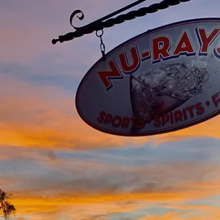 Nuray&apos;s outside sign with a Martinez sunset