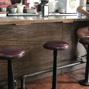 a woman sitting at a counter
