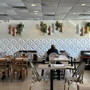 people sitting at tables in a restaurant