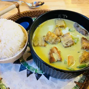 Flavorful Green curry with coconut milk and pork belly