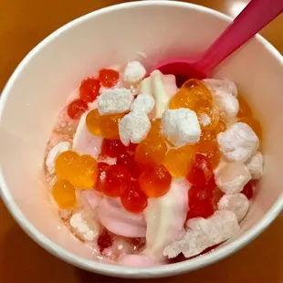 a bowl of yogurt topped with fruit