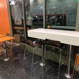 a table and chairs in a restaurant