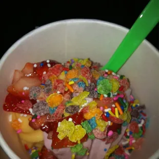 Half mango tango sorbet half raspberry sorbet with sprinkle, fruity pebbles &amp; strawberries ;)