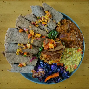 a plate of food on a wooden table