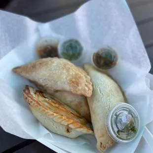 a close up of a basket of empanadas