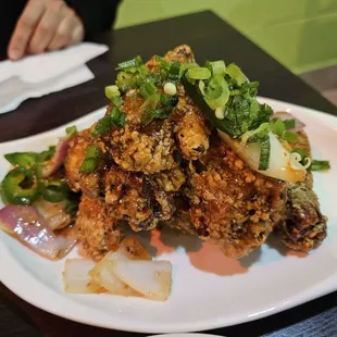 Cánh Gà Chiên (6) / Six Jumbo Pieces. Lightly Battered Wings Topped with NUDO&apos;s Special Sauce, Onion, and Jalapeno.