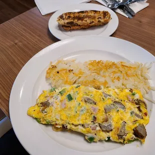 Farmer's Omelet - ham, sausage, peppers, onions, &amp; bacon. Side of raisin toast &amp; home fries.