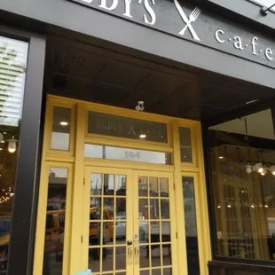 the entrance to nudy&apos;s cafe