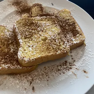 Classic French toast topped with powdered sugar and cinnamon