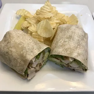 California Wrap served with potato chips and a pickle