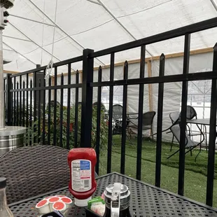 a patio with a table and chairs