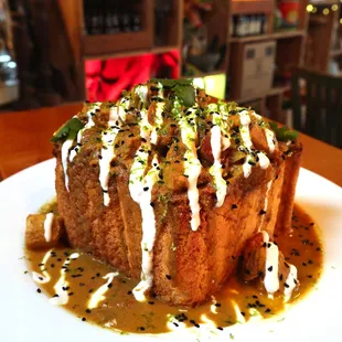 South African Bunny Chow  Chicken Breast, Indian Masala, Lime, Cilantro, Served in a Pullman Bread Bowl