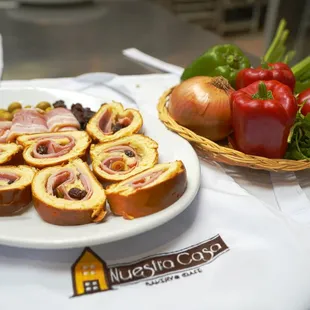 a plate of food and a basket of vegetables