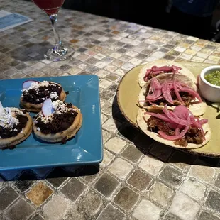 Sopas and pork carnitas tacos.