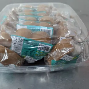 a plastic container filled with donuts