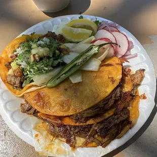 Quesabirria and al pastor taco consomé in the back