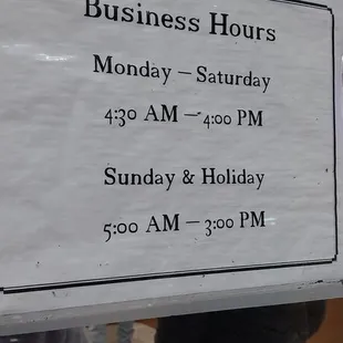 a sign for business hours