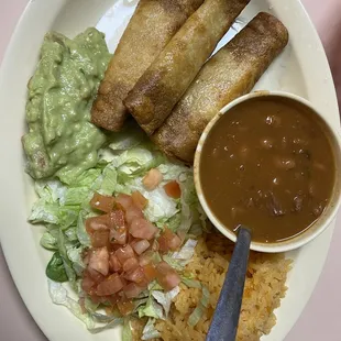 Chicken Flautas. Includes salad, rice, charro beans, and guacamole