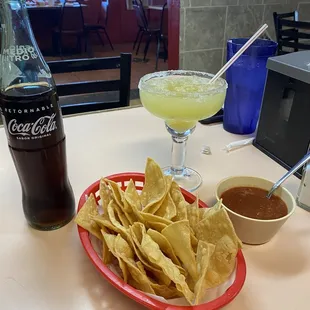 a plate of chips and a drink