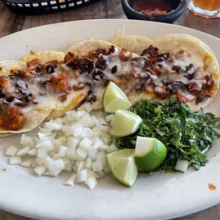 Tacos Taquitos Al Pastor with cheese.  Amazing