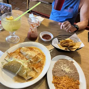 Combination plate with a taco, burrito, and quesadilla with side order of rice/beans!