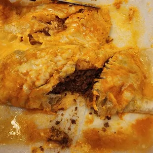 11. Beef Burrito (right), Taco (not pictured) and Enchilada (left). View of protein inside.