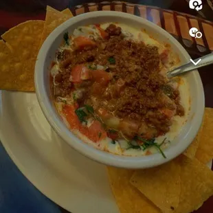 This is the Vallarta Special Dip.  Ground Beef, pico de gallo, with queso on top.