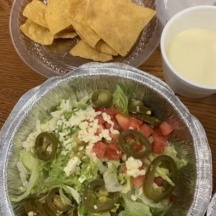 Side salad/toppings, chips, queso