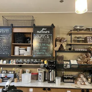 a coffee shop with menus on the wall