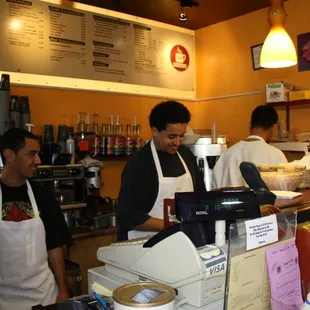 two men working behind the counter