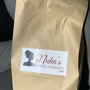 a brown paper bag with a sticker on it