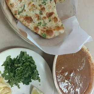 Garlic naan and beef nihari. Too much gravy not enough meat