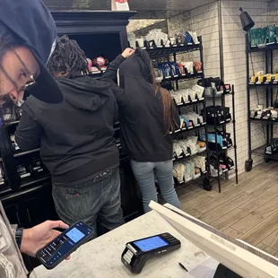 White girl covering her head. If she don't like people she shouldn't be working customer service I'll also file a bbb complaint