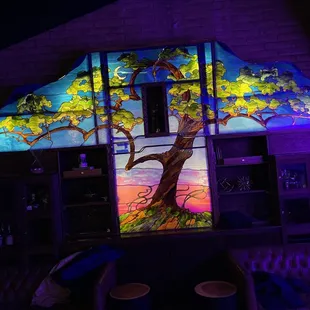 a brightly lit tree in a bar