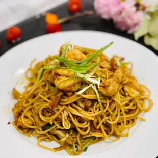 a plate of noodles with shrimp