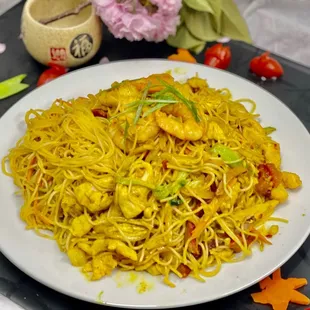 a plate of noodles and vegetables
