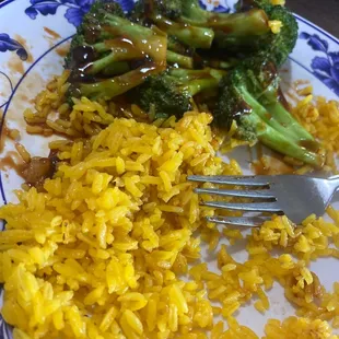 a plate of rice and broccoli