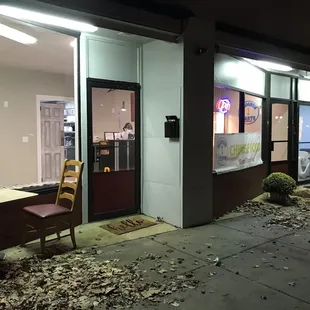 Outside two connected storefront: small outdoor wait area to pick-up during CoViD