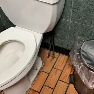 Tongs found in the women&apos;s bathroom.