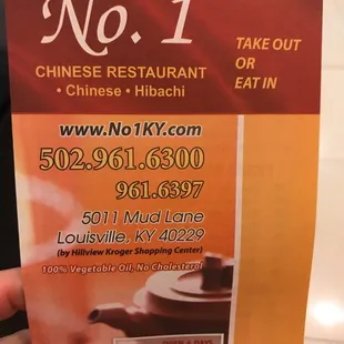 a hand holding a ticket