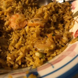 a plate of rice and shrimp