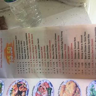 a menu and a bottle of water