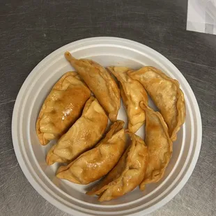 a plate of fried dumplings