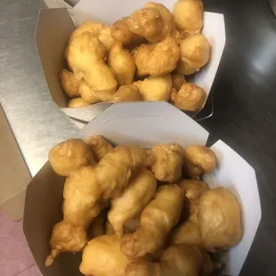 two boxes of fried doughnuts