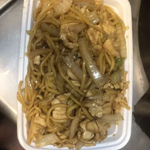 a container of noodles and meat